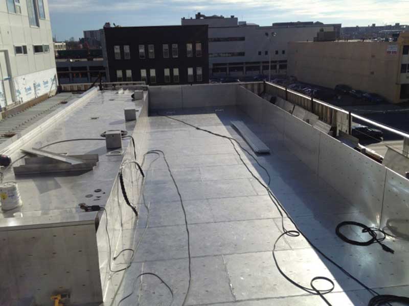 Fitting the stainless steel pool walls and floor.