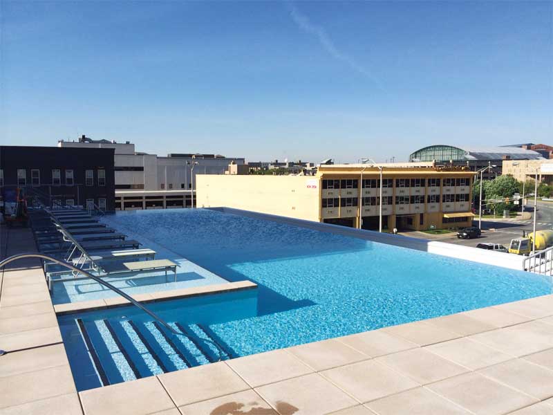 Photo courtesy RenoSys Apartment complex with rooftop pool in downtown Indianapolis