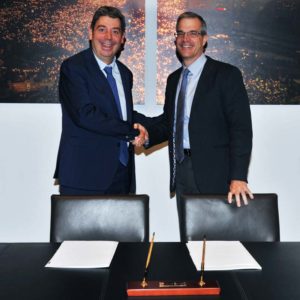 Photo courtesy Fluidra-Zodiac Fluidra and Zodiac executives shake hands and announce the merger of the two companies.