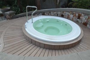Photo courtesy MoistureShield Composite deck built around hot tub