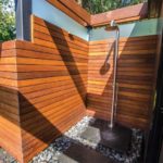 A private outdoor shower is attached to the cabana/bar.
