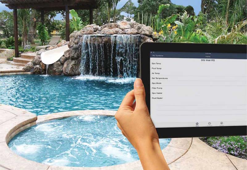 Photo courtesy Zodiac Pool Systems Canada Inc. Homeowner controlling their backyard pool via tablet