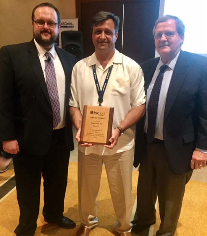 Photo courtesy Fox Pool Corporation Fox Pool Corporation presents award to its oldest dealer