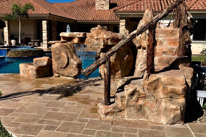 Photo courtesy South Texas Pools Manufacturers of component water features also offer systems that make it easy to build rock staircases.