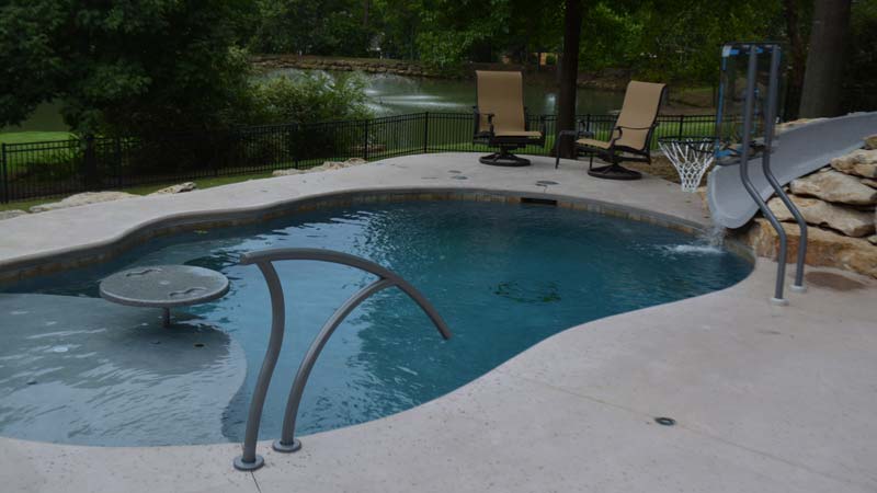 Photo courtesy Inter-Fab Inc. This pool includes an area for adults to entertain and socialize, as well as a place for children to play and have fun.