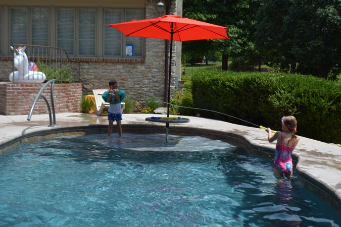 Photo courtesy Inter-Fab Inc. The middle-shallow section of the pool is often the perfect place to install a bench.