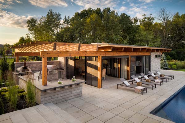 Photo by Jeff McNeill / Photos courtesy Pool Craft, Techo Bloc, and Cedar Springs The outdoor kitchen (attached to the cabana), is conveniently located poolside and has a variety of amenities.