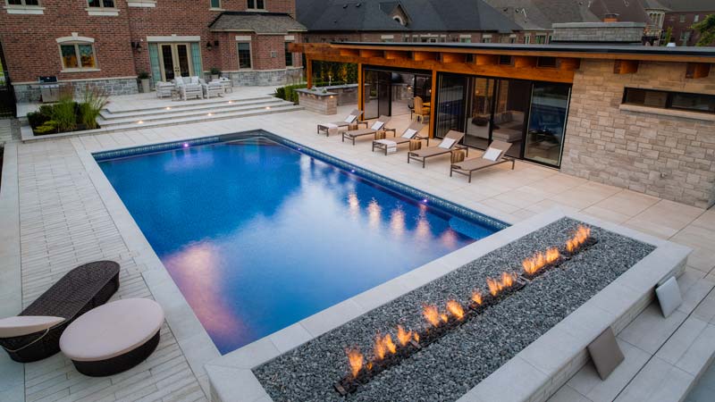 Photo by Jeff McNeill / Photos courtesy Pool Craft, Techo Bloc, and Cedar Springs A 6.1- x 12.2-m (20- x 40-ft) vinyl-lined pool was installed as part of a collaborative feature project.