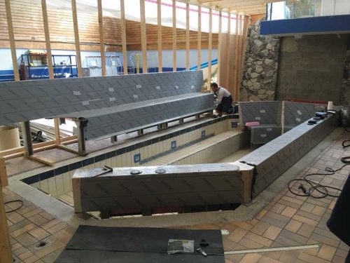 Photo courtesy Stainless Steel Pool & Spa earl mah aquatic centre. The designers planned the appearance to match the original shape of the installation, including its staircase and shape of the benches.