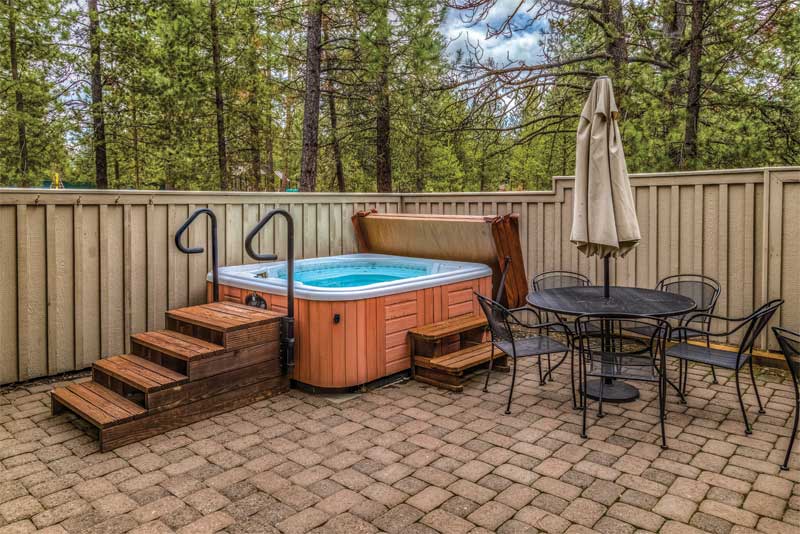 Photo © JetCowan/AdobeStock Many community bylaws also require hot tubs to be covered for safety reasons in regard to effective weight distribution and locking straps to prevent the cover from wear and tear during strong winds as well as unauthorized entry.