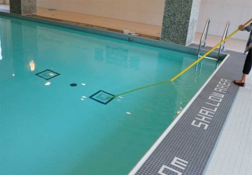 The pool’s main drain covers (either side of the black disc) must be securely fastened and in good condition to prevent accidental entrapment. Also, the disc should be clearly visible from any point 9 m (29.6 ft) from the deck.