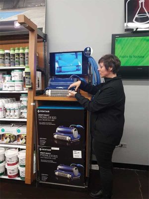 Some stores have a robotic cleaner display area near the water-testing station with a video display, showing exactly how the cleaner works.