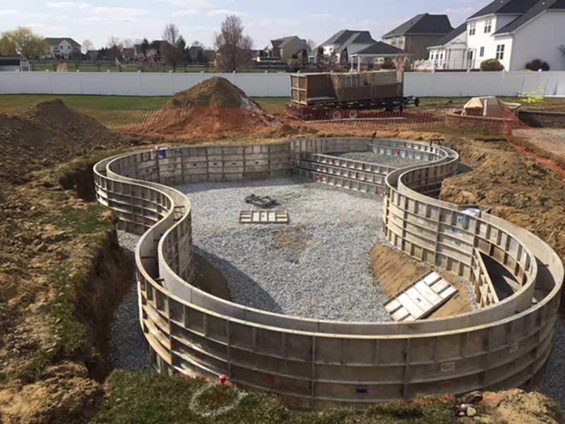Photo courtesy AquaForms Once the forms, plumbing, and structural steel are in place, a special design mix of concrete is used to create a 254-mm (10-in.) thick wall.
