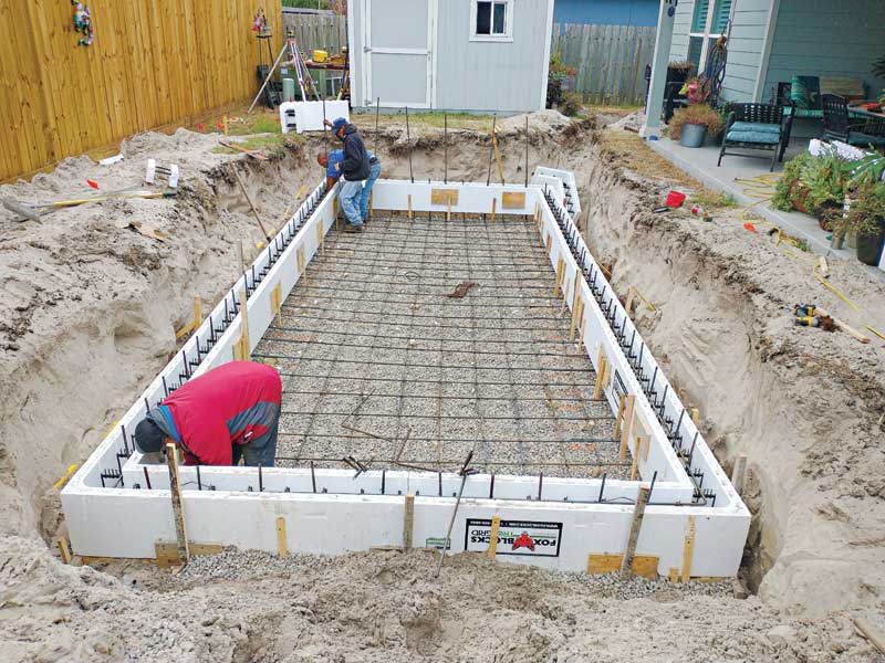 The built-in insulation incorporated within the insulated concrete form (ICF) system serves to curtail heat loss and maintain pool temperatures, effectively insulating the pool’s interior from the colder soil surrounding the pool structure.