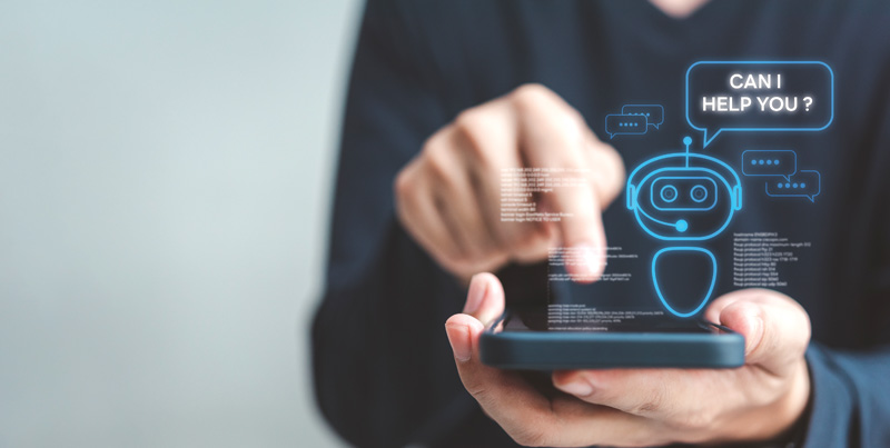 A person interacts with a smartphone displaying a chatbot icon and text saying, "Can I help you?" in a digital interface.