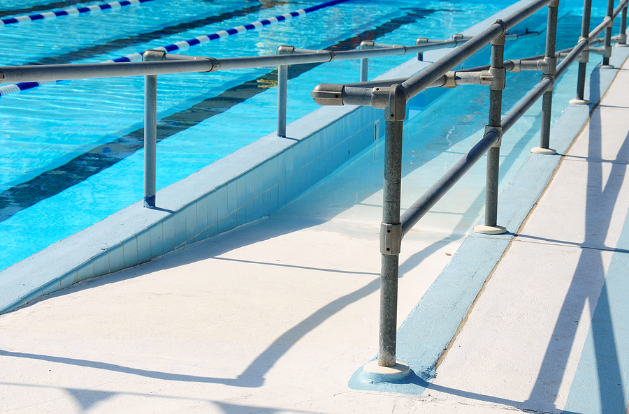 Handicap ramp leading into community swimming pool.