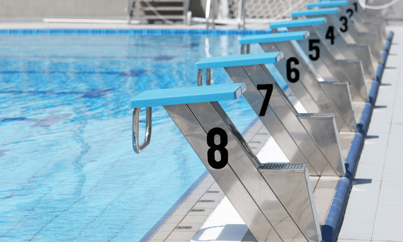 pool in in an aquatic facility with diving boards