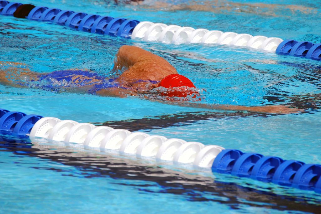 Young woman swimmer in training at an aquatic center in ft.lauderdale florida